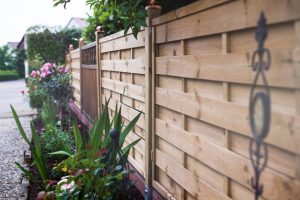 Wooden garden wall on the street.